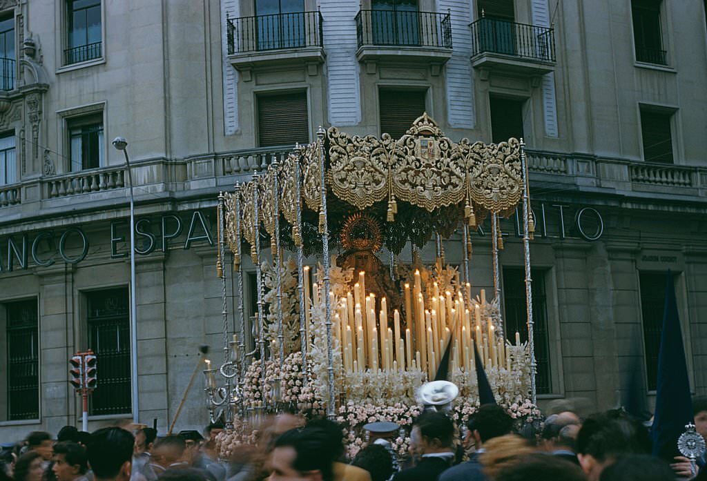 #8 A paso or float surmounted with an effigy of the Virgin Mary during Semana Santa or Holy Week in Seville, Spain, circa 1960.