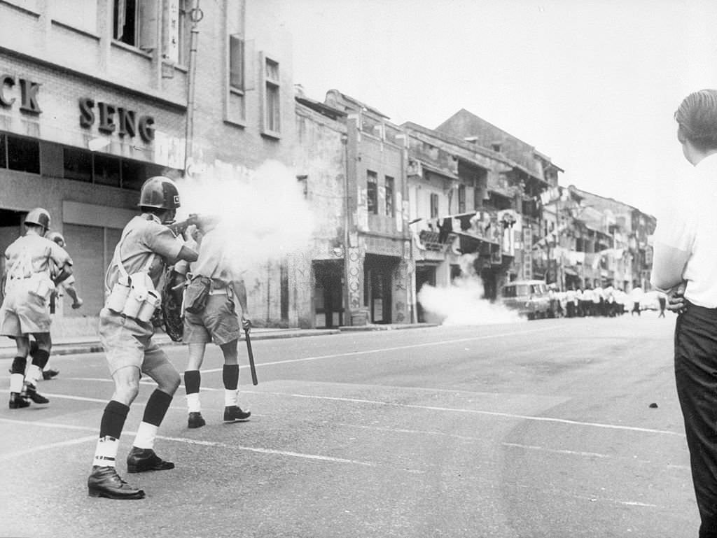 #13 Minesweeper Departs For North — Here friends and relatives wave farewell as the ship pulls out from its berth, 1965
