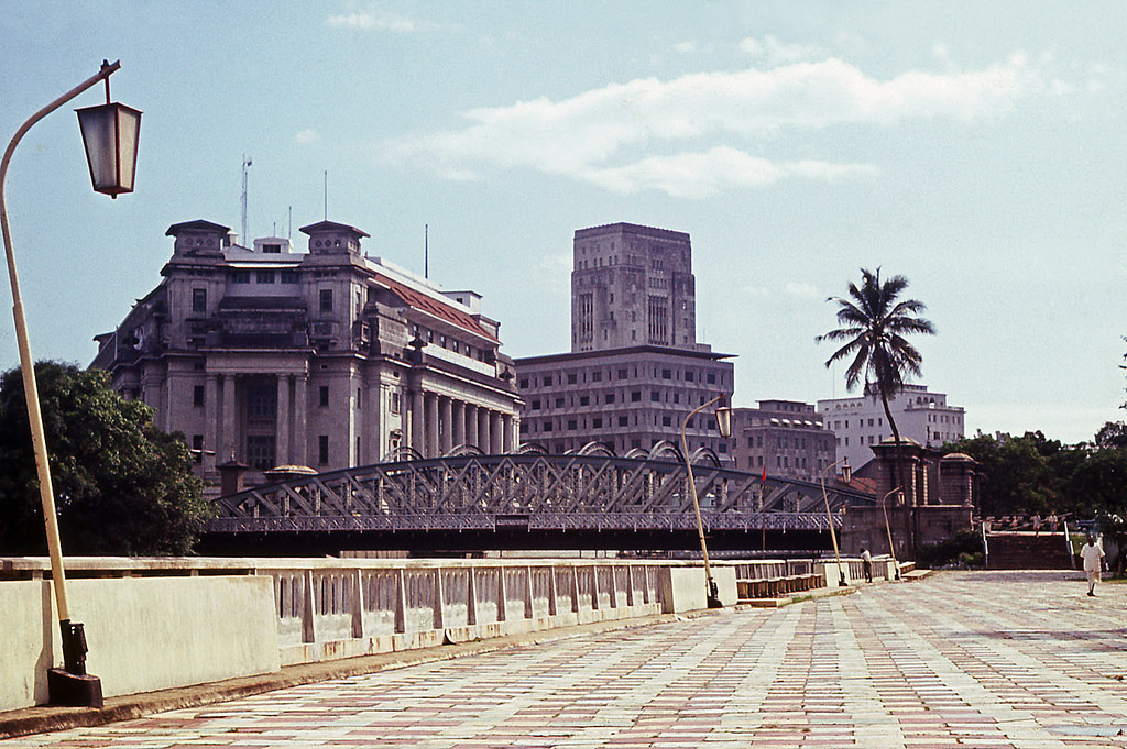 #131 The Fullerton Building (on the left, originally used as the Central Post Office, now a five-star Fullerton hotel) and the Bank of China building (middle) – Singapore’s tallest building in 1966.