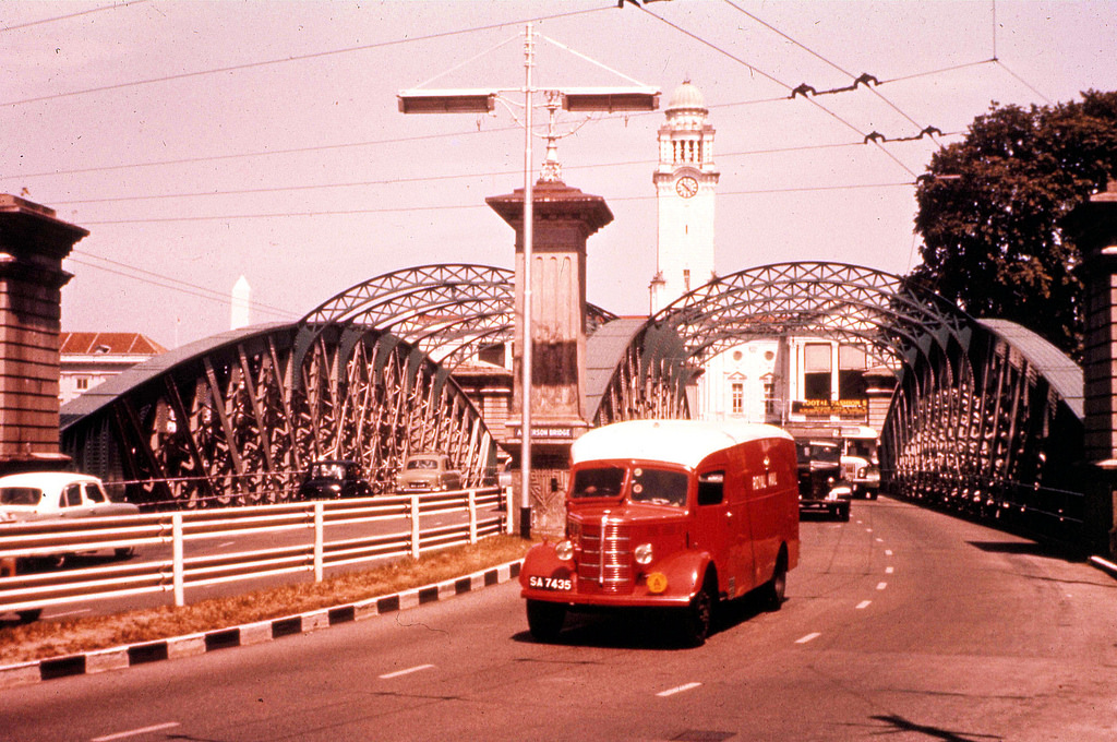 #148 Postal vans cross a bridge in central Singapore in 1960.