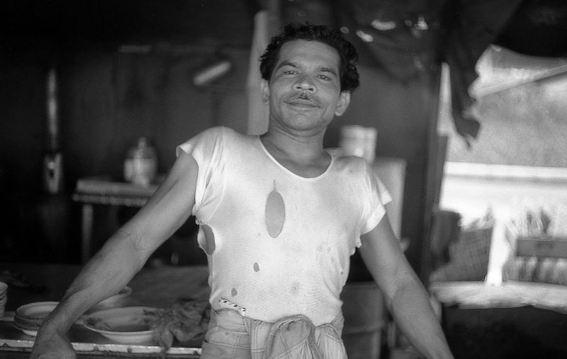 #167 One of the stallholders on the food stalls at Sembawang village, 1960s