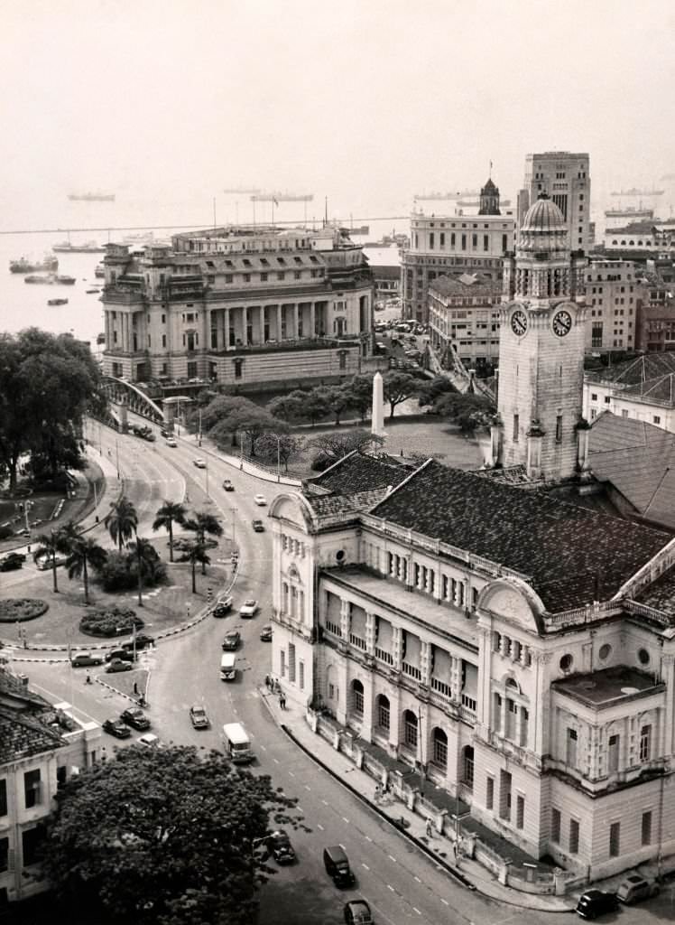 #49 Victoria Memorial Hall in the foreground with the Fullerton Building, originally an office building, then the General Post Office and latterly a five-star hotel (behind), on the Singapore River, 1962