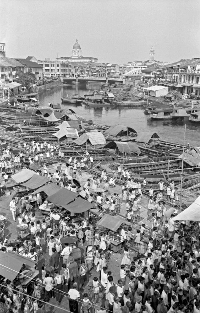 #58 People crowding an outdoor market, Singapore, 1962