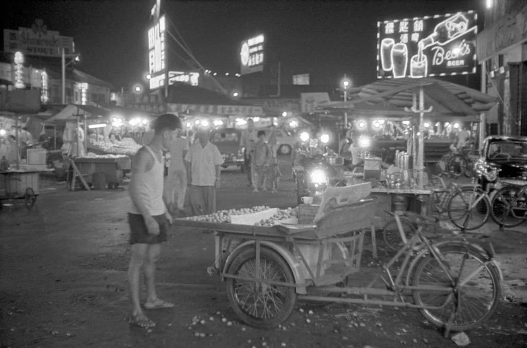 #97 People walking at the outdoor market of Singapore, 1962