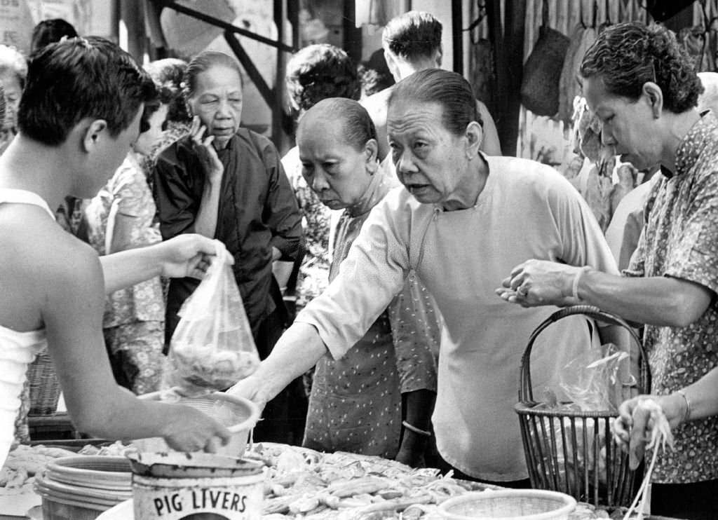 #25 True Blacks and Whites of Singapore (named for their black pants, white blouses) are renowned among amahs, 1970