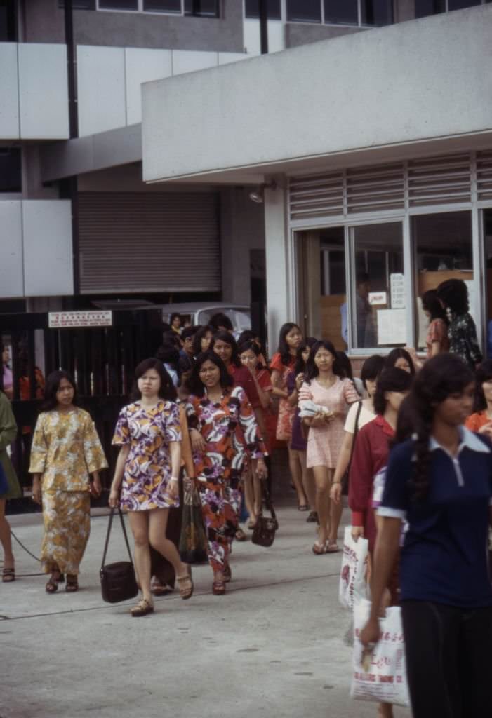 #33 Workers leaving the ‘Rollei’ camera factory in Singapore in the 1970s.