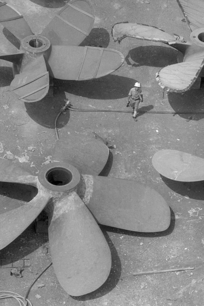 #40 Boat propellers at a shipyard in Singapore, July 1974.