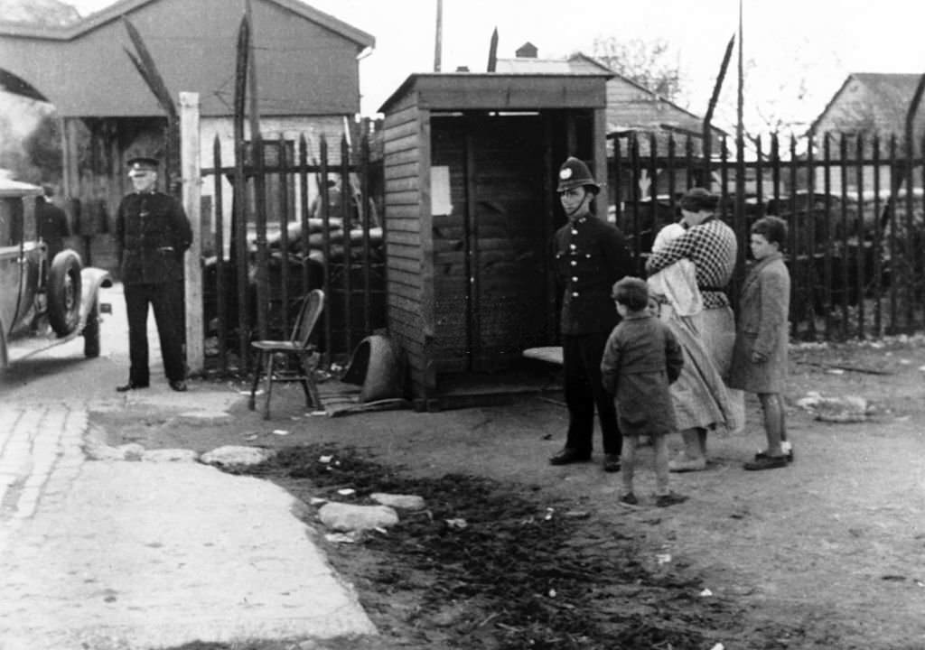 #124 During the Spanish civil war, in Gibraltar, British sentries are guarding the only entry Spanish refugees can enter.