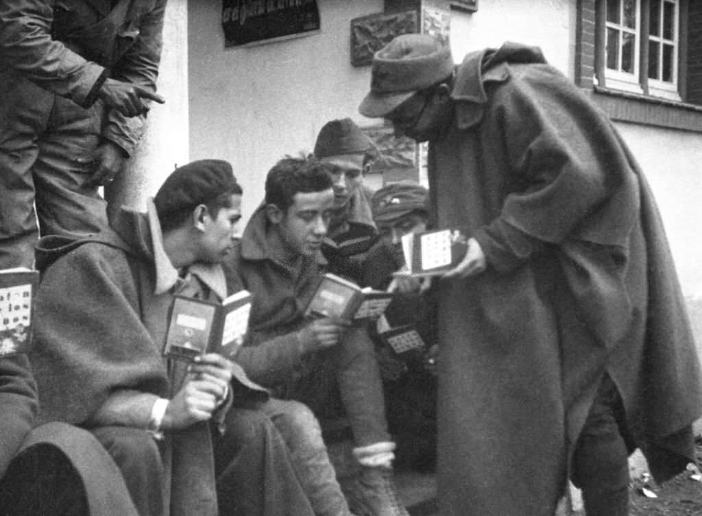 #126 Republican militiamen learning to read in Madrid during the Spanish Civil War, March 1937.