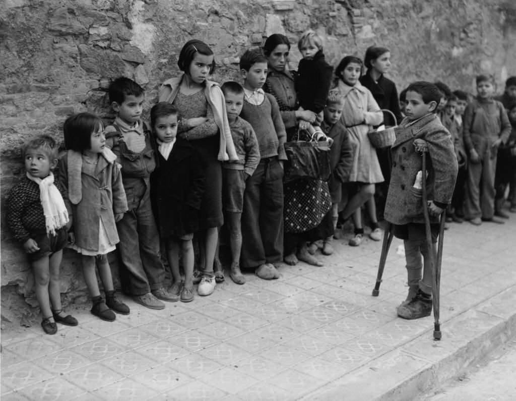 #127 Children queuing for milk rations, Spanish Civil War (1936-1939), December 1937