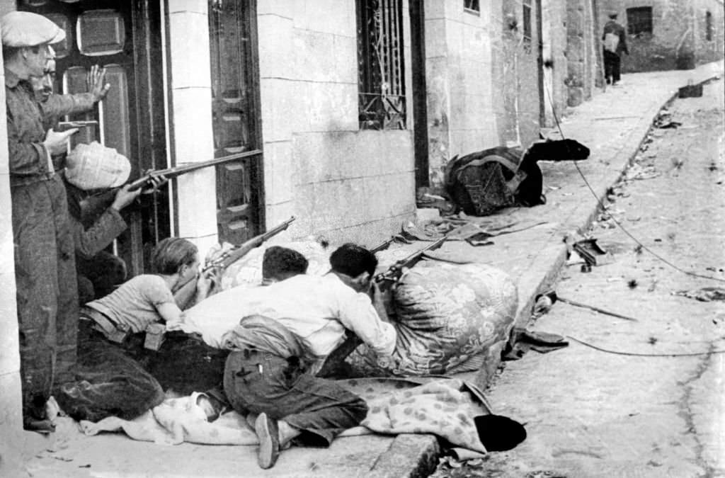 #13 Republicans fighting in a street of an unidentified village, 1936