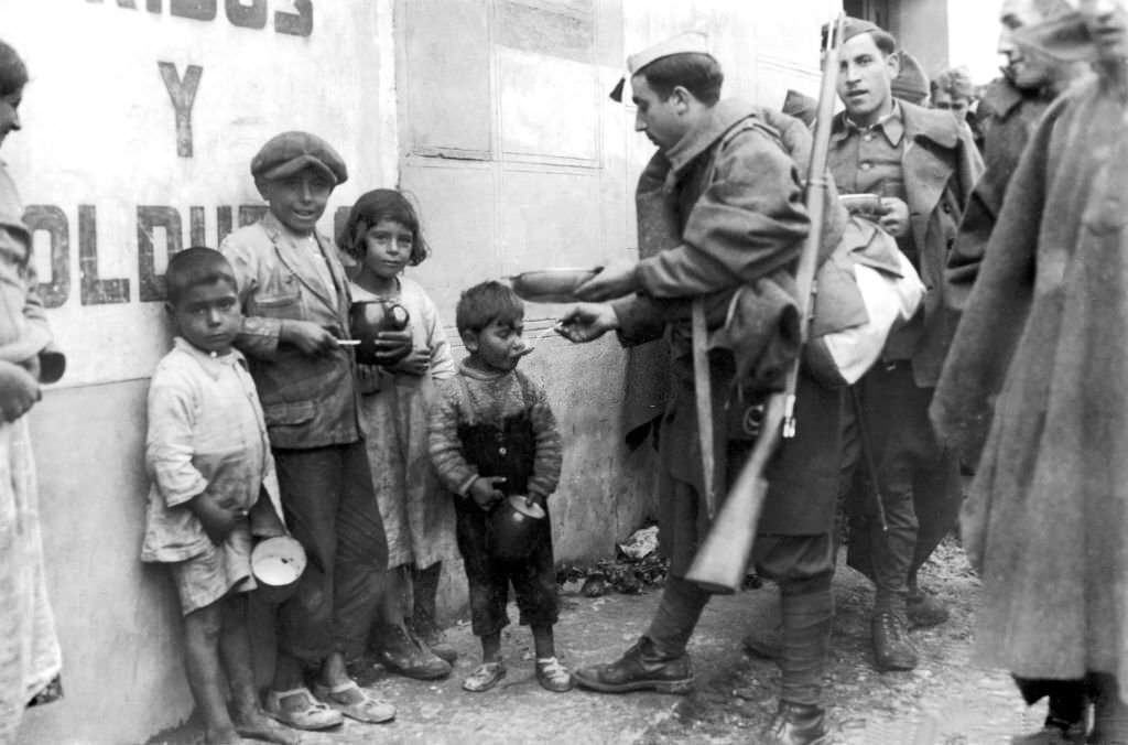 #130 Nationalist Soldiers Giving food provision to Children in Madrid, 1936