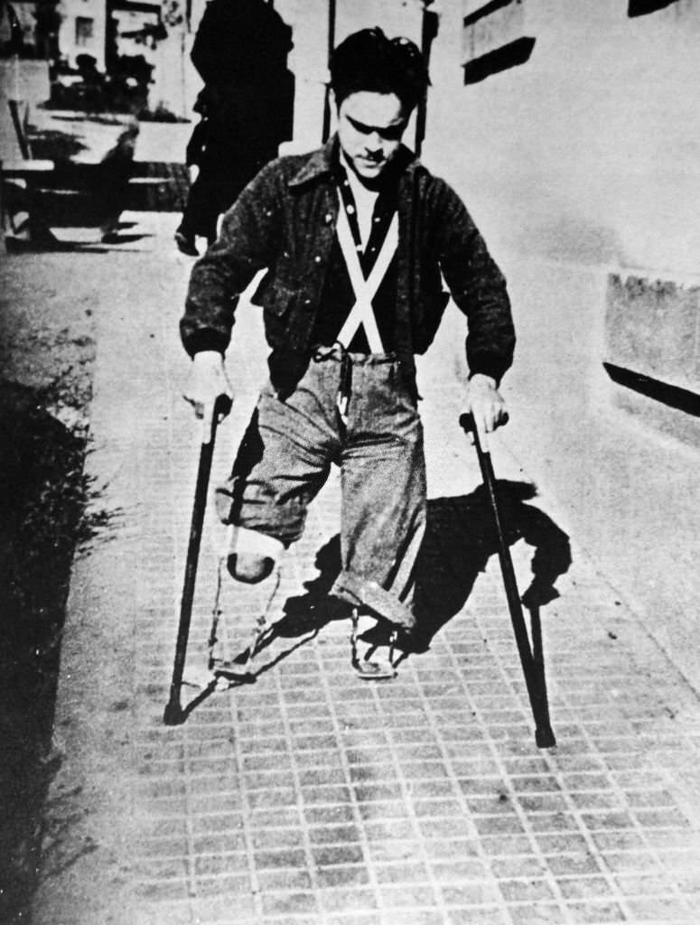 #152 Amputee war veteran, in a Spanish street during the Spanish Civil War.