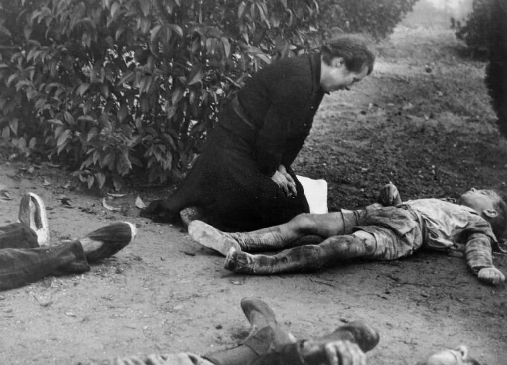 #29 Child victim of bombing in Lerida and his mother, Spain, during the Spanish Civil War
