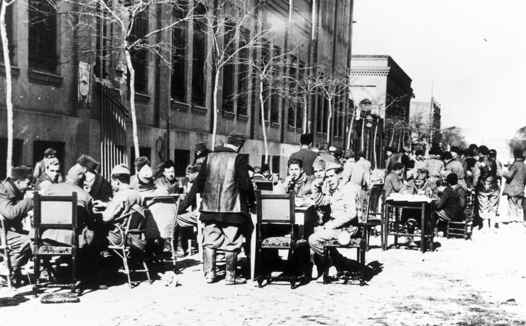 #30 Government militiamen having lunch behind the front lines, Spain, 1937