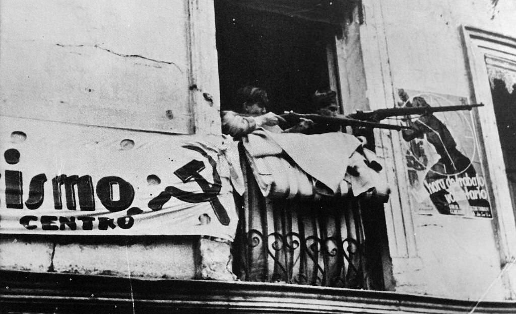 #32 Militia fighters resist the advancing nationalist army in Madrid during the Spanish Civil War.