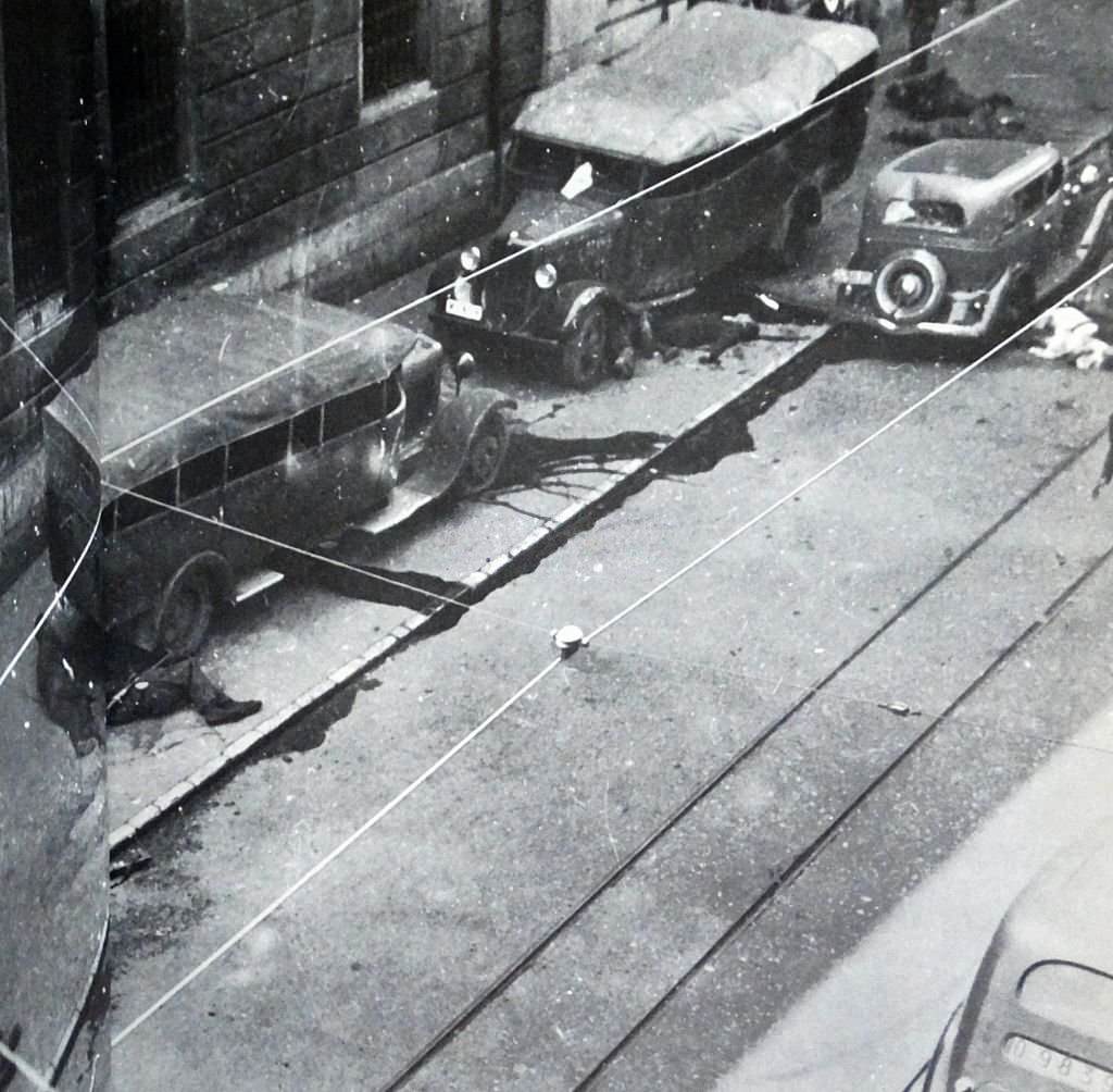 #40 Casualties and injured lie on the streets during the Siege of Gijón.