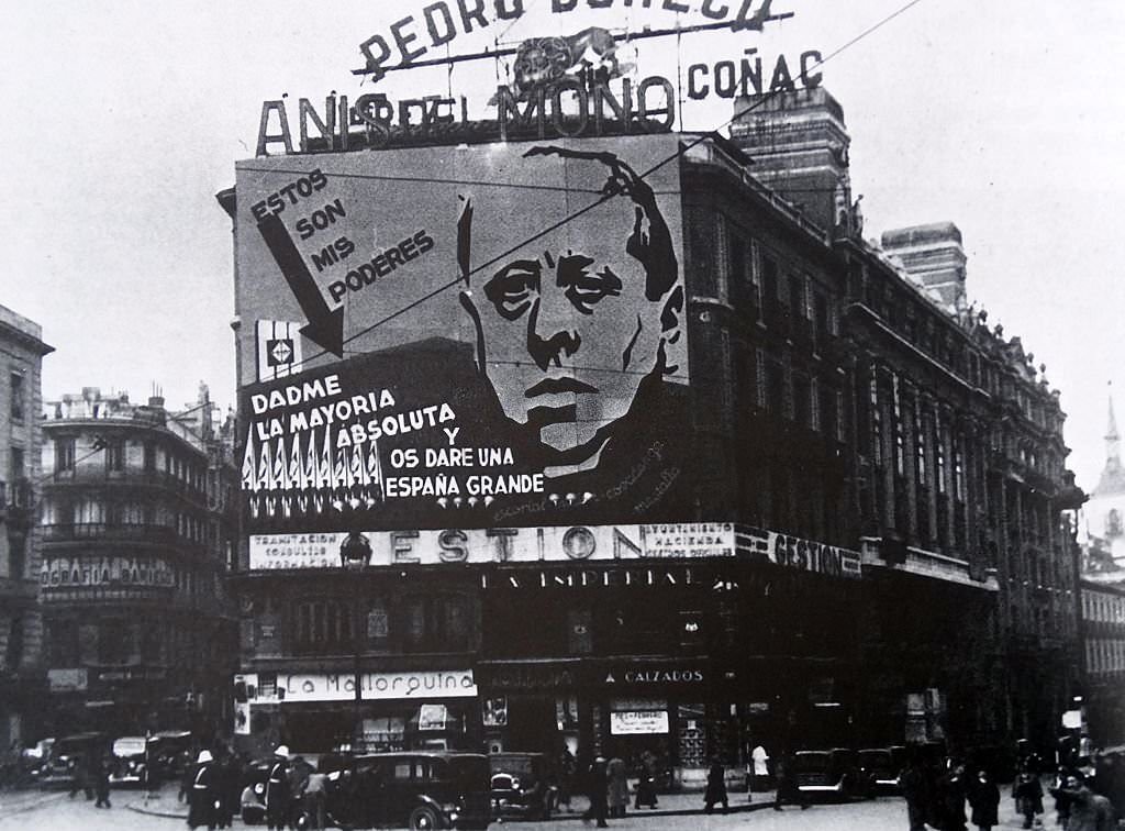 #70 Poster on a Madrid building depicts José María Gil-Robles y a prominent Spanish politician in the period leading up to the Spanish Civil War, speaks in Parliament in 1936.