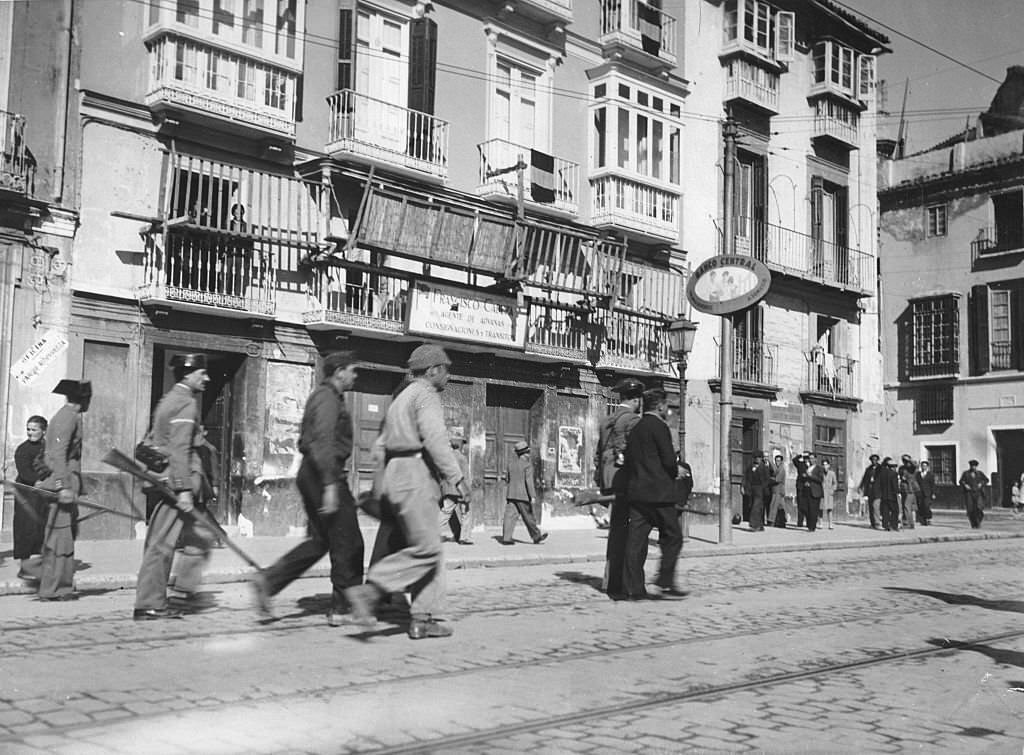 #81 Spanish Civil War Supporters of the Republicans are led away after the capture of the city by the Nationalists on 7 February 1937