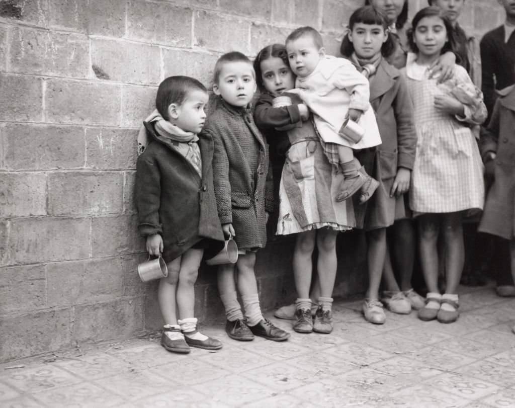 #85 Children queuing for milk rations, Spanish Civil War (1936-1939), December 1937.
