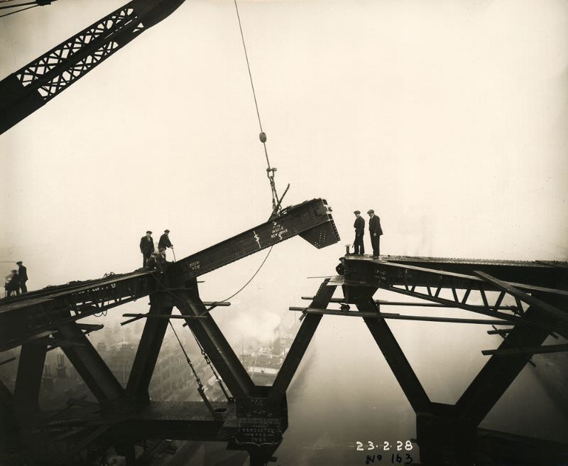 #10 The Tyne Bridge arch is nearly complete as a girder is lowered into place above the River Tyne, February 23, 1928