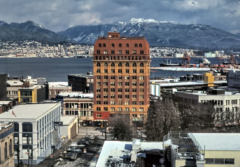 #11 The Dominion Building on east side of downtown Vancouver as seen from VVI/VCC college in early 1986. Victory Square and Hastings Street are in the foreground
