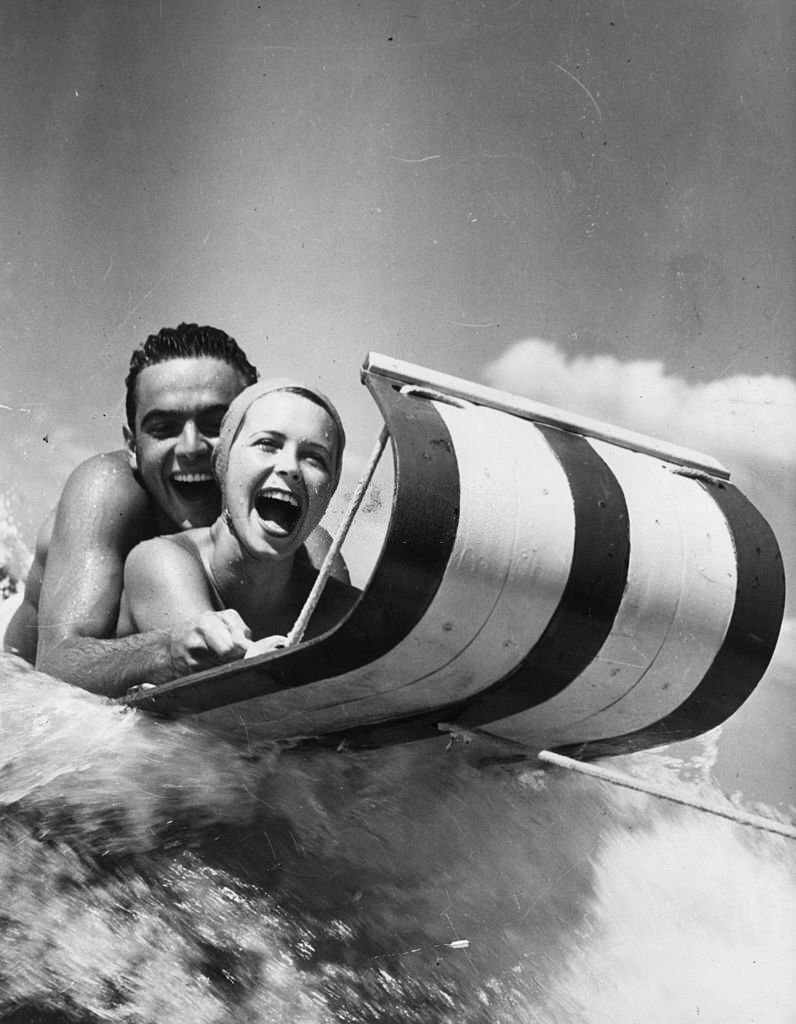 #129 Two holidaymakers on a water toboggan at Cypress Gardens, Florida, 1968