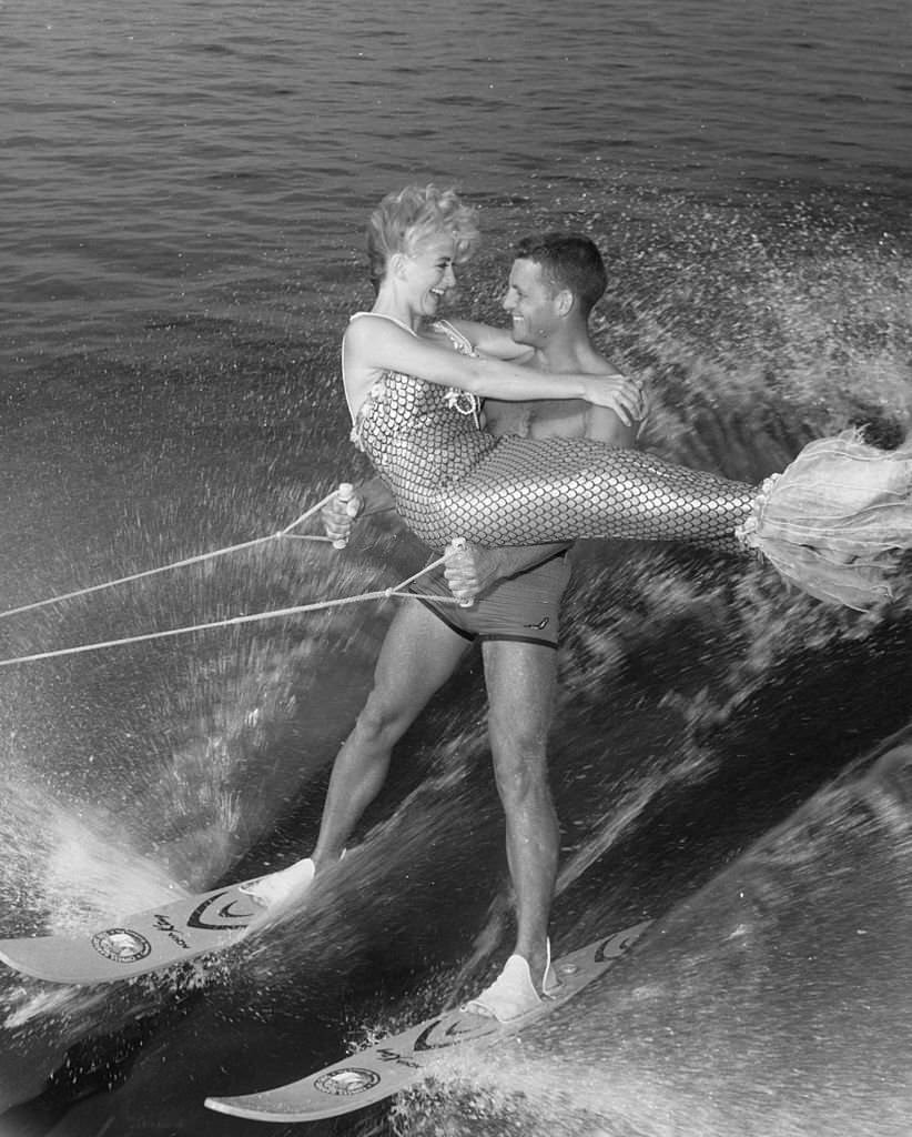 #134 Water-ski champion Dick Pope and mermaid Jenny Phillips speed across the course at the US Ski Centre at Cypress Gardens, Florida, 1967