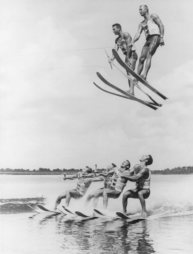#137 A high speed water-skiing team demonstrate advanced techniques of a stunt named ‘flying high and dry’, at Cypress Gardens, Florida, 1965