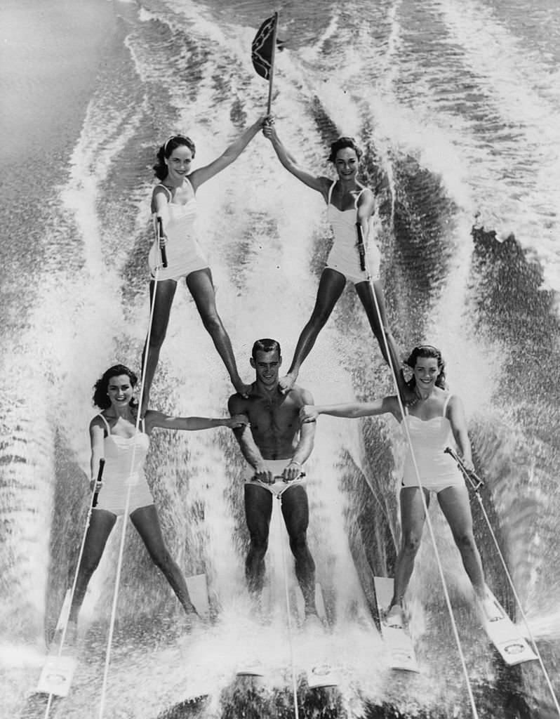 #138 Water-ski champion Dick Pope speeds across Lake Eloise at the US Ski Centre at Cypress Gardens, Florida, flying the flag of the Southern State, 1965