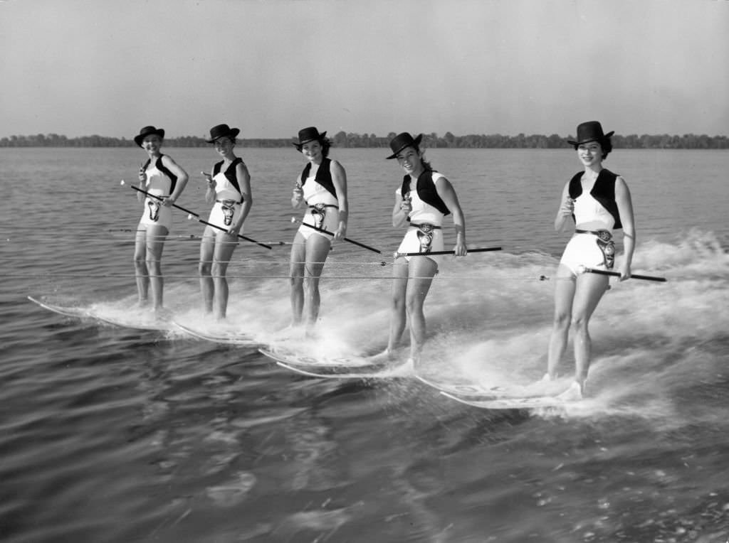 #145 Five girls with six-shooters form the Cowgirl Water Posse, whose new water-skiing show ‘Tough, Mighty Tough in the West’ is causing a stir at Cypress Gardens, Florida, 1965