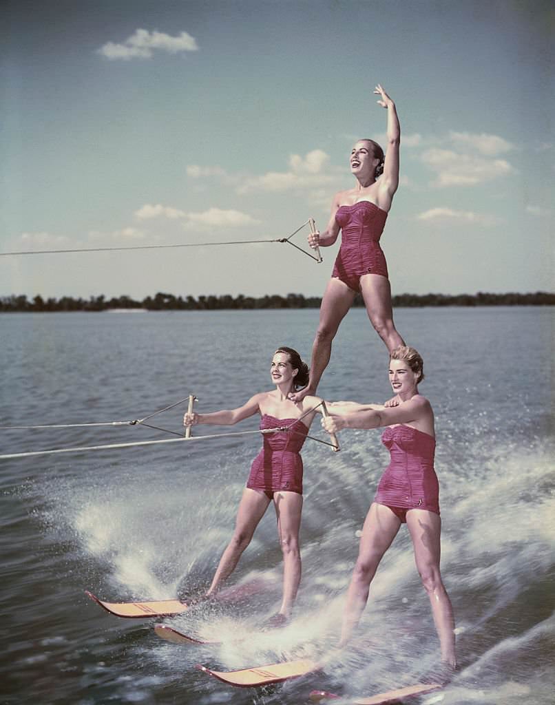 #14 Water skiing champion Nancie Cooper, top, balances on two ladies during a water skiing acrobatic show at Cypress Gardens in Florida, 1956