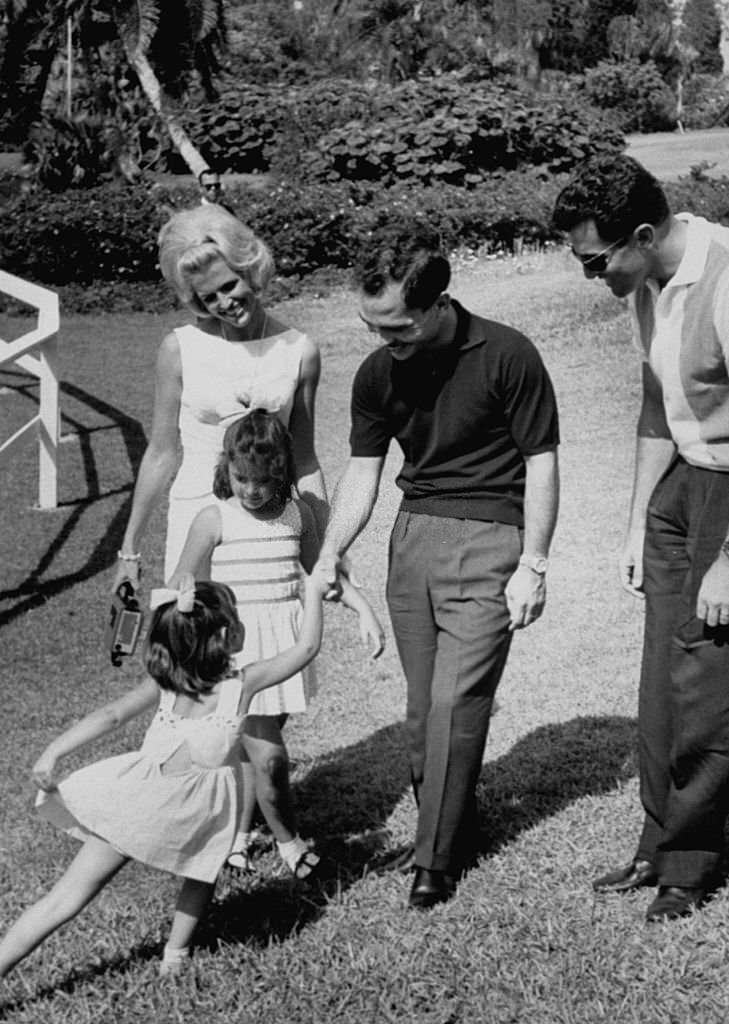 #149 A curtsied welcome given to King Hussein Ibn Talal (2R), during his visit to Cypress Gardens.
