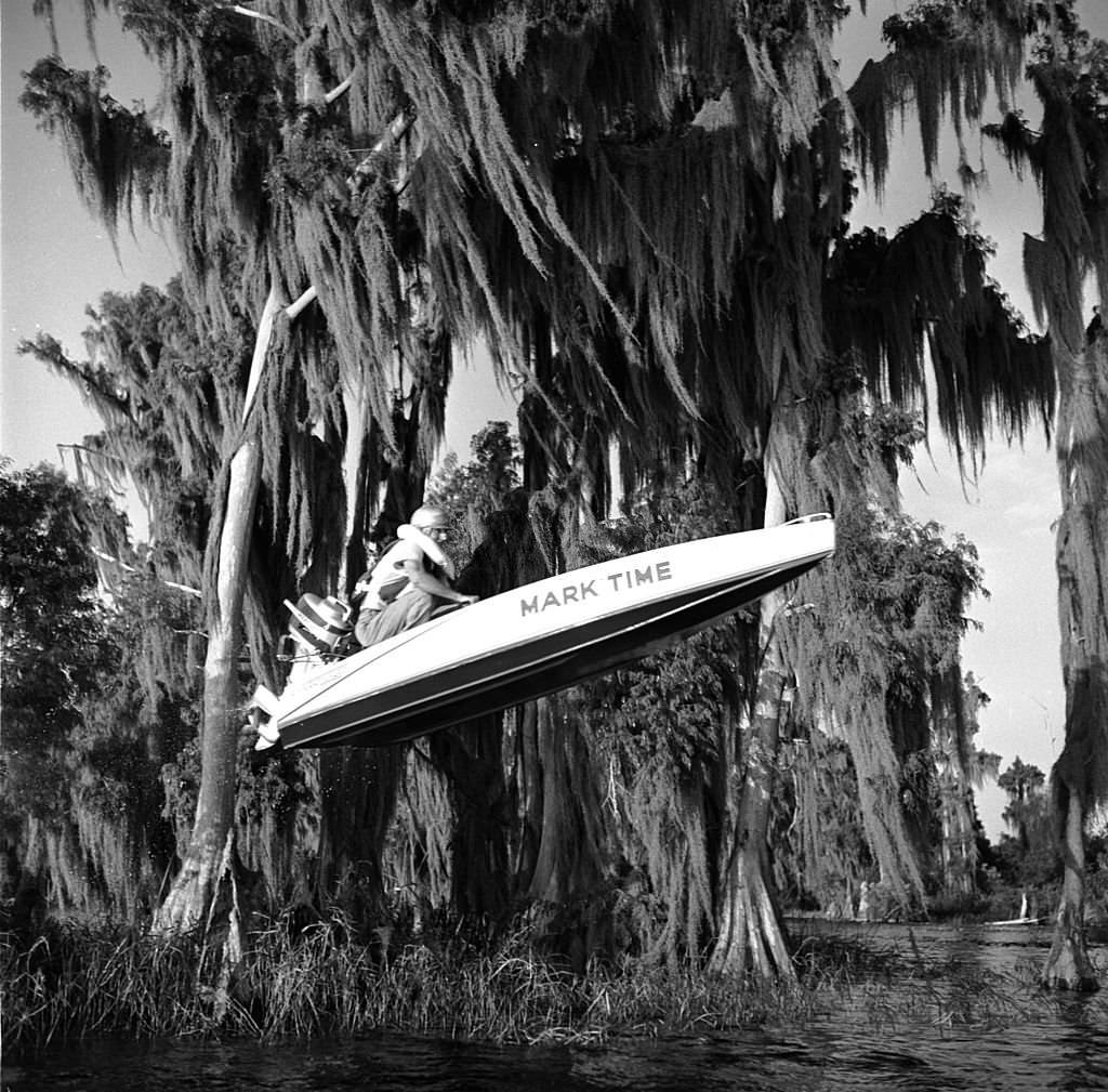 #15 Mark Time takes his speedboat over the last hurdle in the Cypress Gardens racecourse, Florida, 1956
