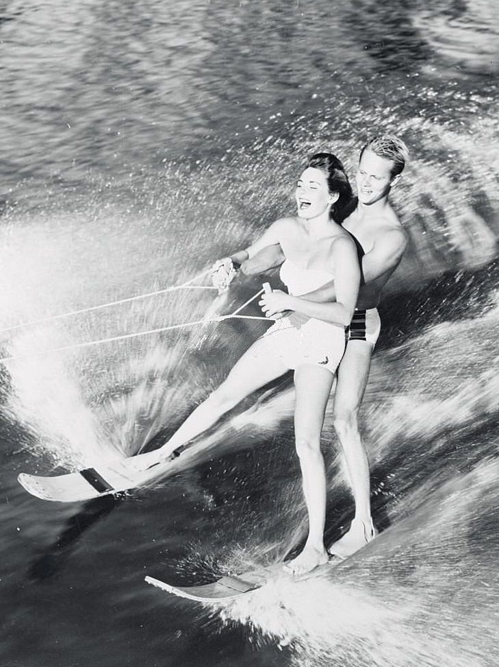 #24 Pretty Pat Johnson of Inglewood, California, is a welcome passenger aboard Roger Wises’s water skis, as they cut through the water at Cypress Gardens, 1950s