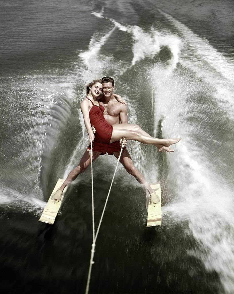 #45 A pair of acrobatic water skiers perform during a show at Cypress Gardens theme park in 1953 near Winterhaven, Florida.