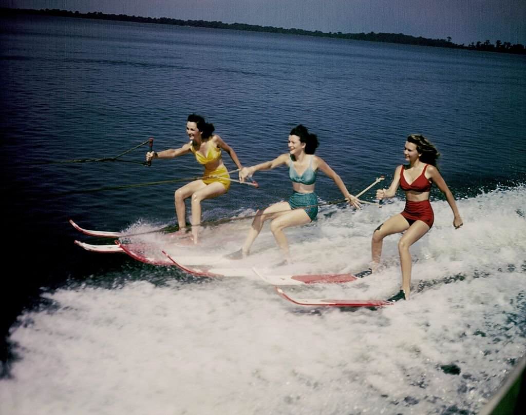 #58 A trio of acrobatic water skiers perform during a show at Cypress Gardens theme park in 1953 near Winterhaven, Florida.
