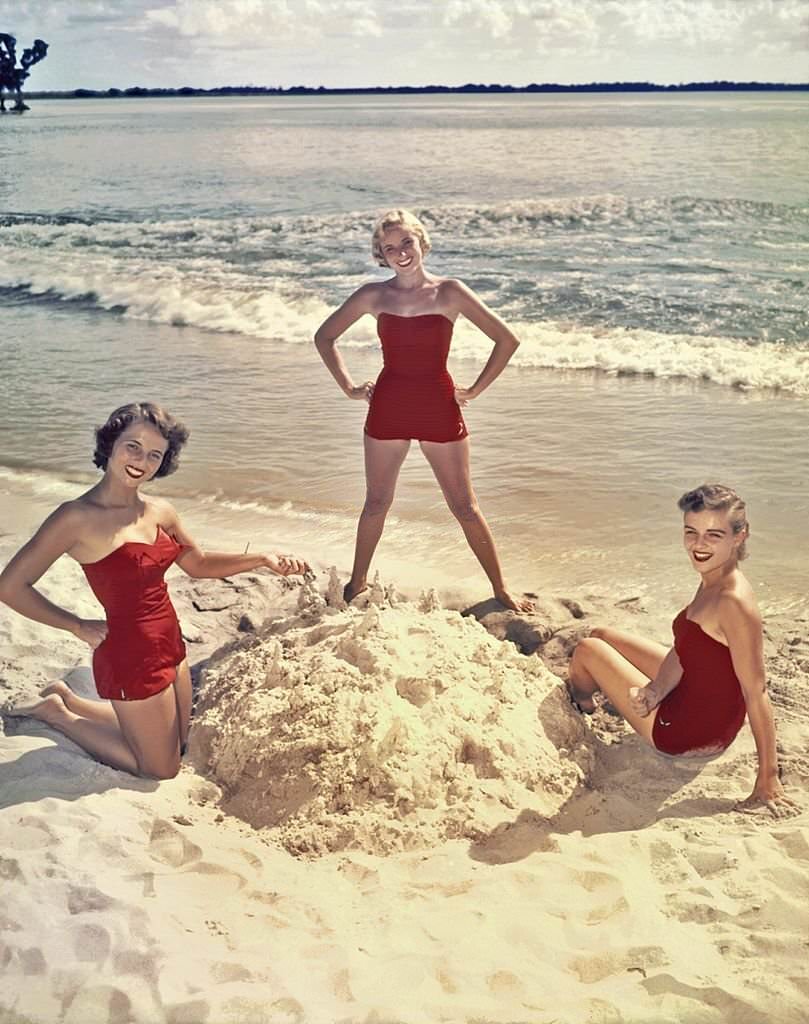 #71 A group of southern belle models pose on the beach at Cypress Gardens theme park in 1953 near Winterhaven, Florida.