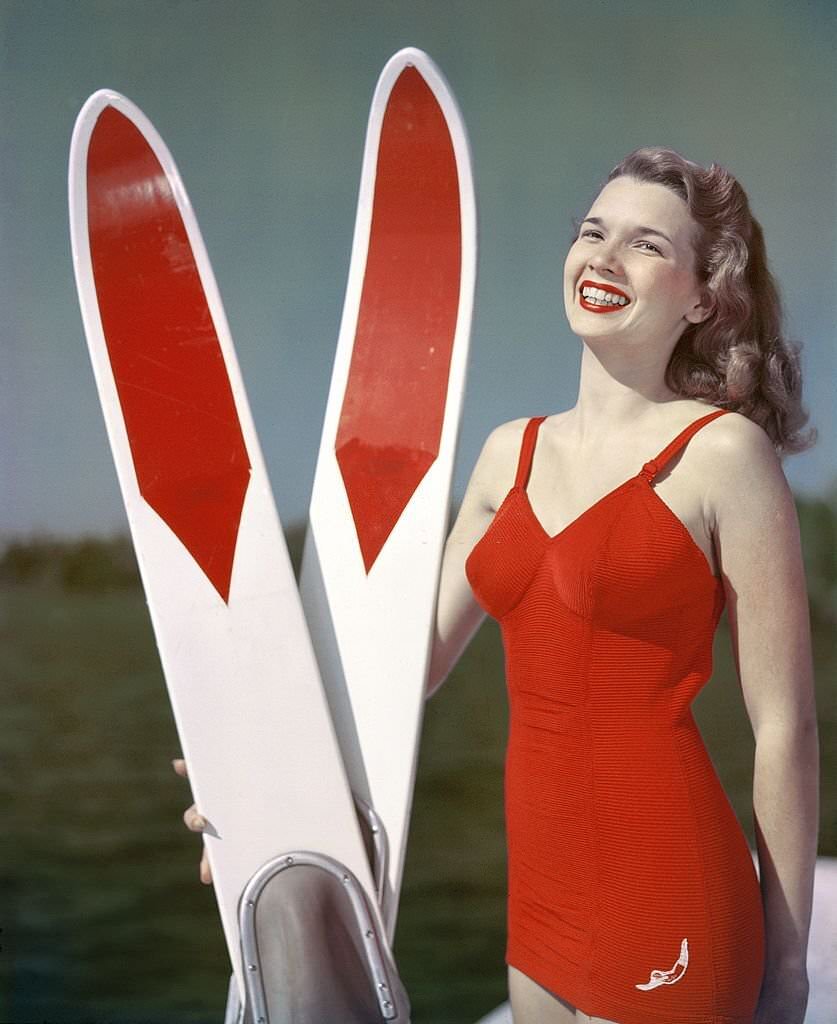 #80 A southern belle model poses with her water skis at Cypress Gardens theme park in 1953 near Winterhaven, Florida.