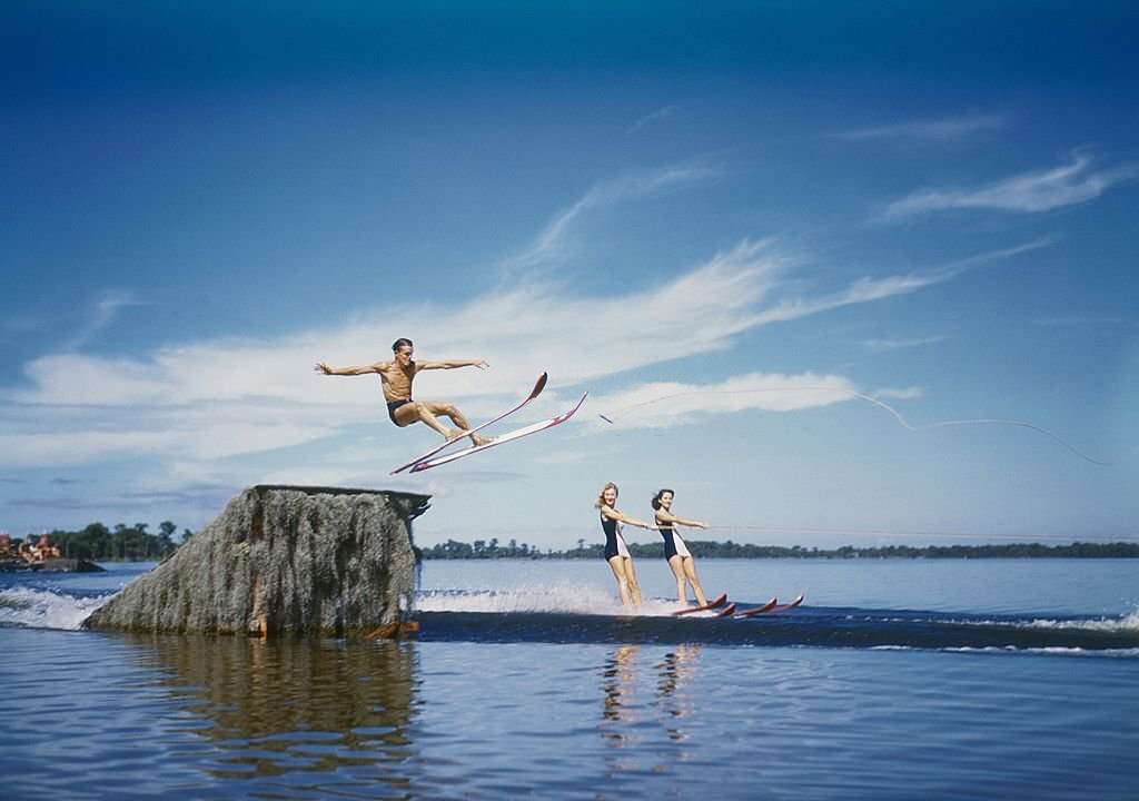 #82 A trio of acrobatic water skiers perform during a show at Cypress Gardens theme park in 1953 near Winterhaven, Florida.