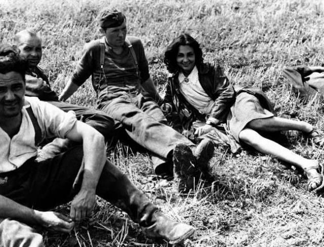 #40 This French girl, who was engaged to a German soldier, refused to leave him even after he was captured and confined in a prisoner of war stockade on August 26, 1944.