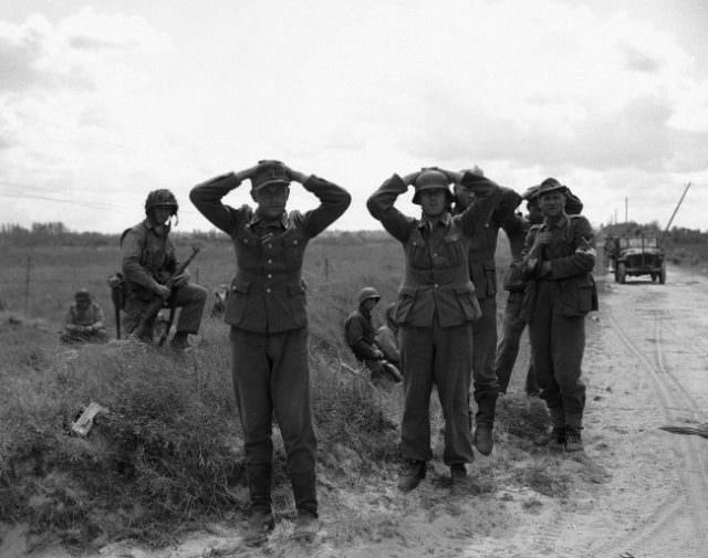#7 Some of the first German soldiers to surrender to the Americans during the battle of the Normandy beaches on June 9, 1944.