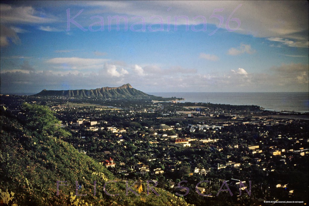 #12 Late afternoon aerial view from Punchbowl Crater of Honolulu and Waikiki on south shore Oahu, 1950s.