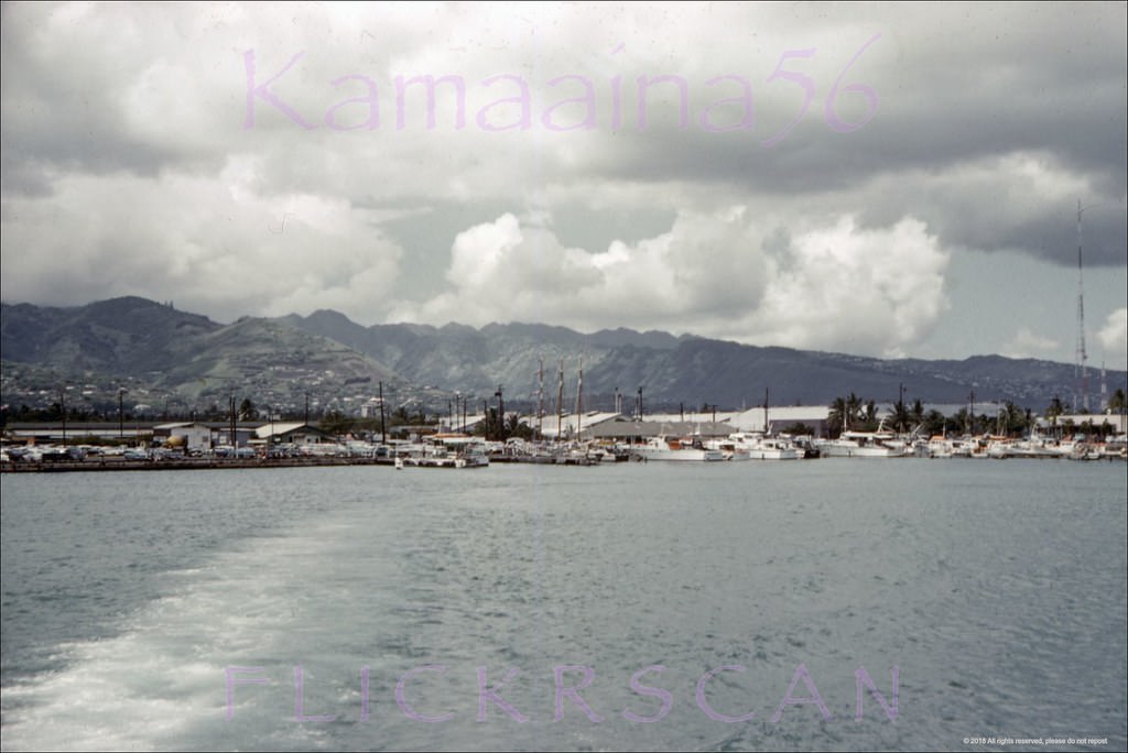 #60 Looking inland from a boat leaving Kewalo Basin on Oahu’s south shore, 1960