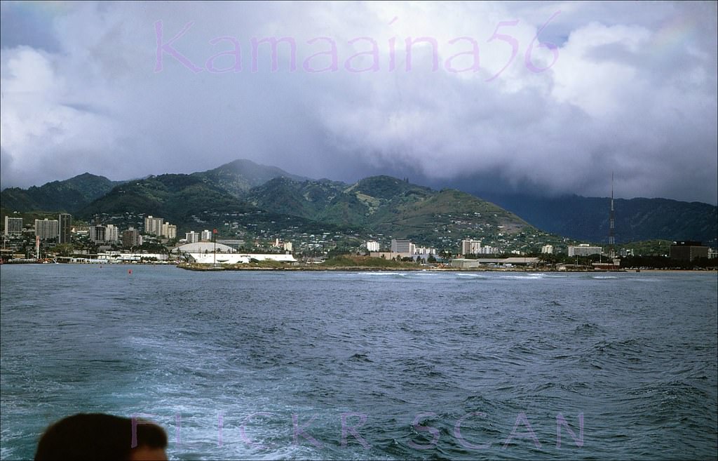 #61 Mauka (inland) view from a cruise boat leaving Kewalo Basin on Oahu’s south shore probably headed for Pearl Harbor or possibly Waikiki, 1968