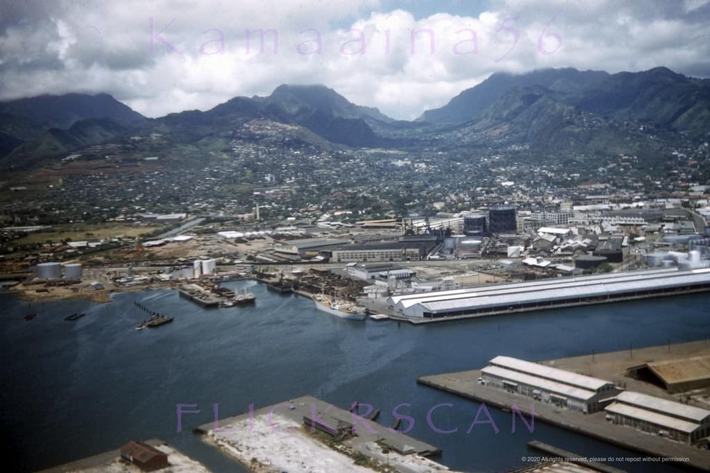 #142 Slightly shaky but nicely detailed airplane view of the west side of Honolulu Harbor looking mauka (inland) from above Sand Island, 1950s