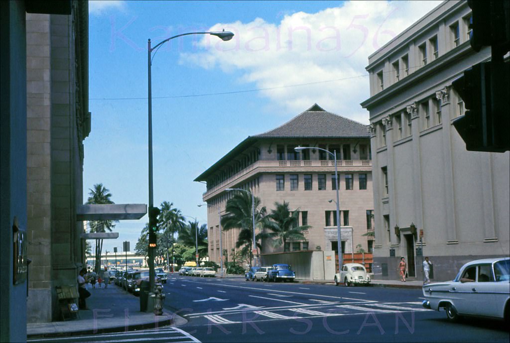 #140 Looking towards the harbor along Bishop Street at the intersection with South King Street in downtown Honolulu, 1966.