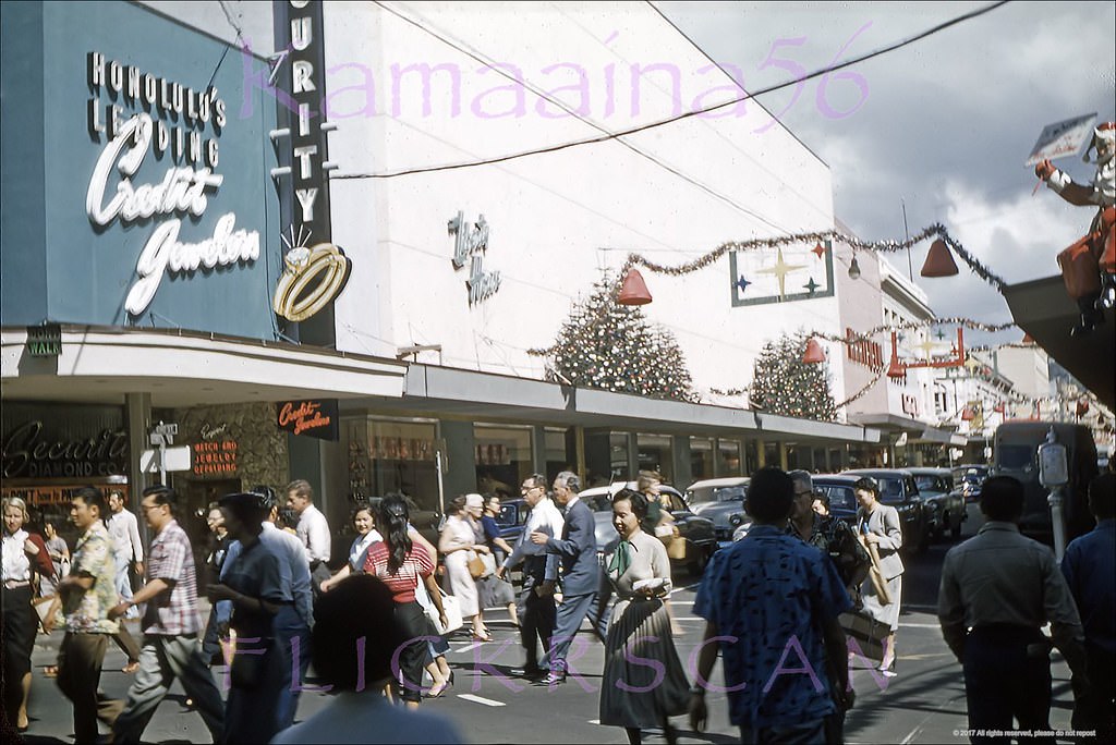 #168 Christmas shopping in downtown Honolulu looking mauka (inland) along busy Fort Street from South King Street in the foreground, 1950s