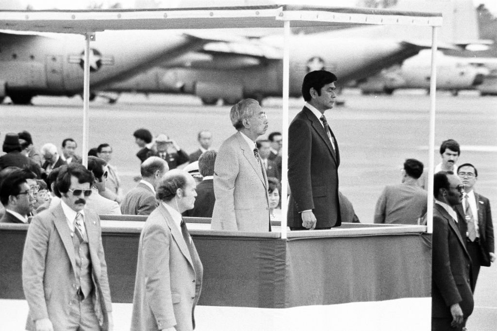#4 Emperor Hirohito attends the farewell ceremony with Hawaii Governor George Ariyoshi at Hickam Field on October 13, 1975 in Honolulu, Hawaii.