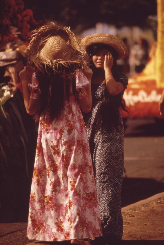 #36 Candid full length standing portrait of women dressed for the Aloha Day parade during the annual Aloha Week festivities, Honolulu, Hawaii, October, 1973.